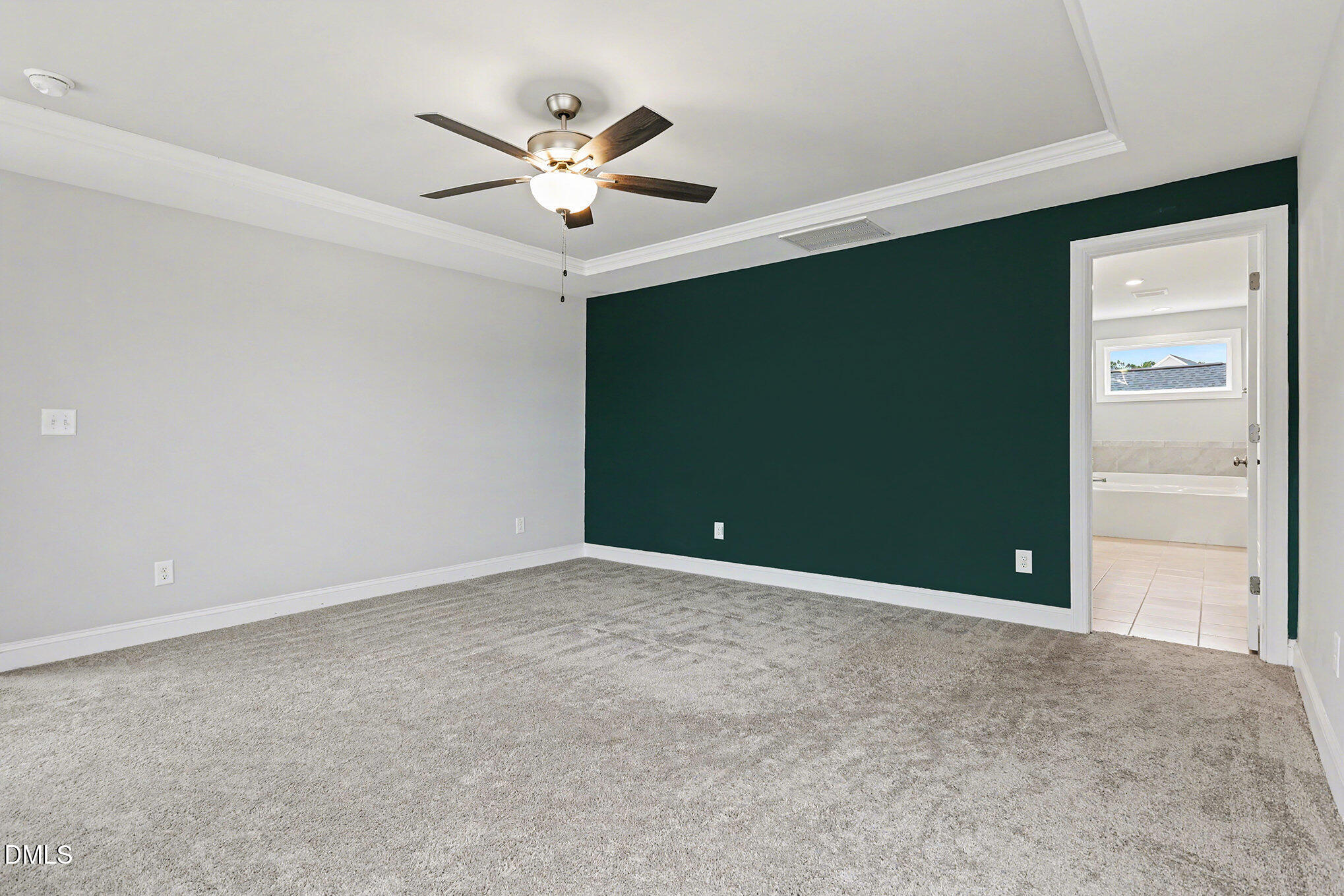 274 Howards Crossing Drive Wendell, NC 27591 - Photo 15 of 40 a view of an empty room with a ceiling fan