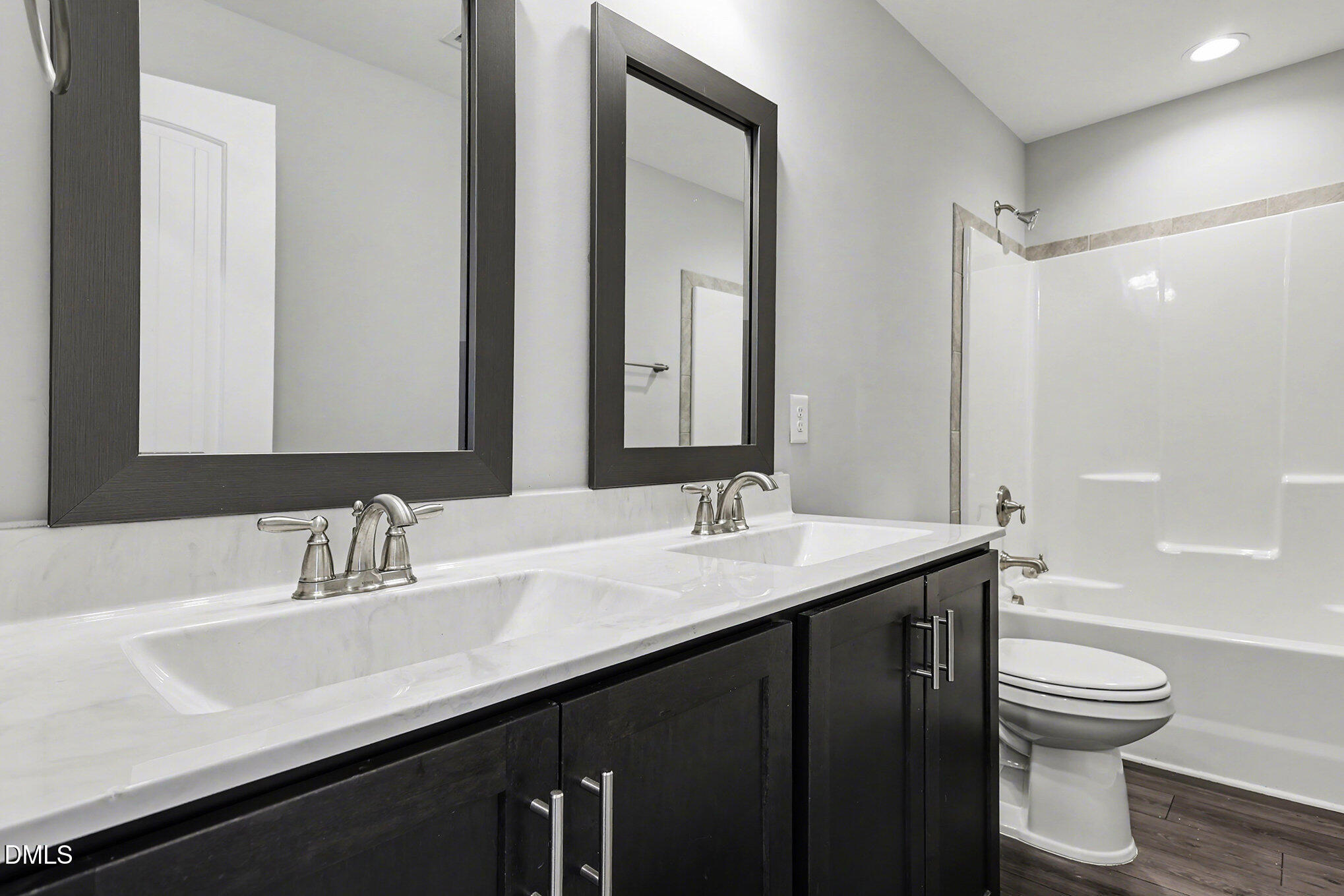 274 Howards Crossing Drive Wendell, NC 27591 - Photo 16 of 40 a bathroom with a sink a toilet and shower