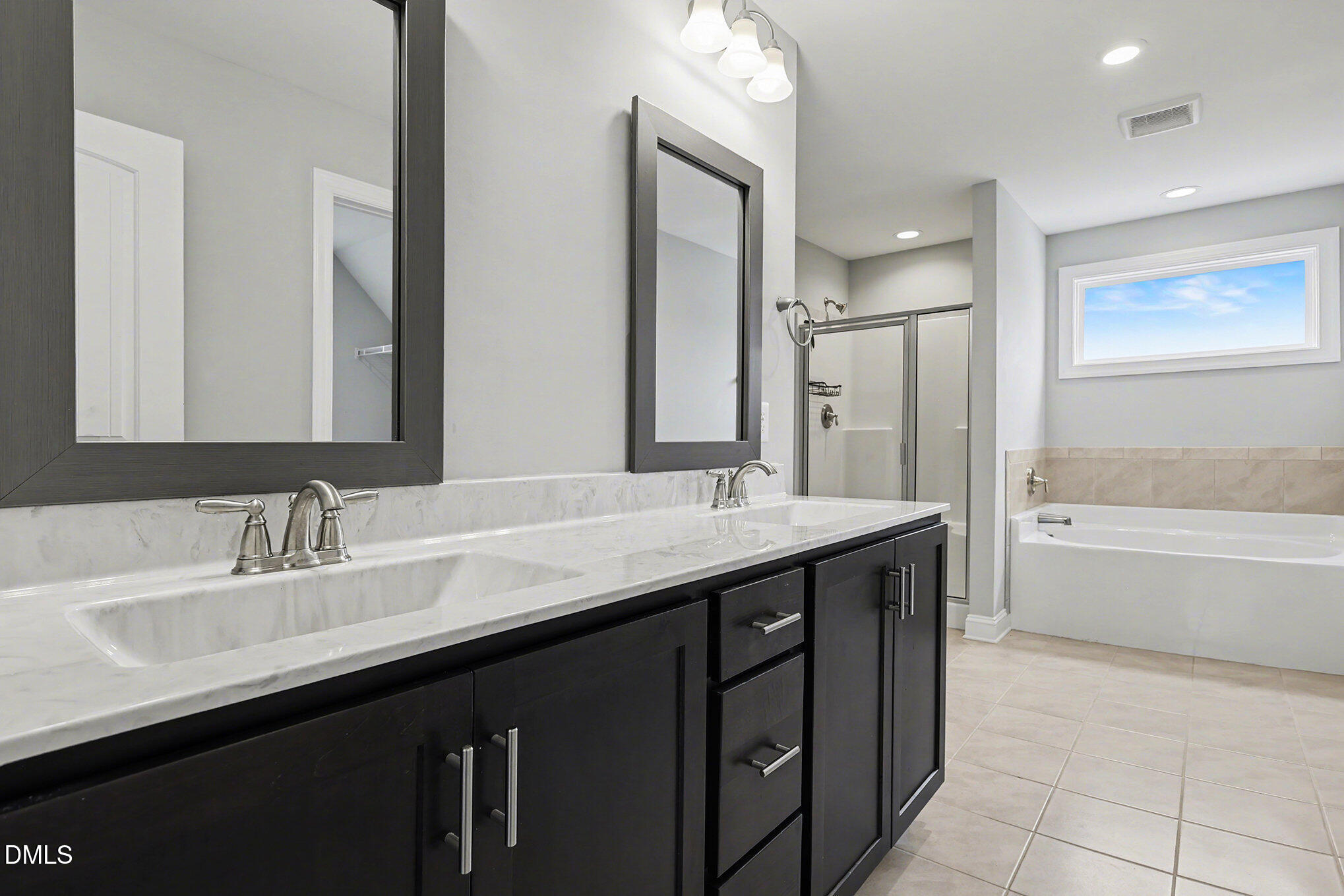 274 Howards Crossing Drive Wendell, NC 27591 - Photo 17 of 40 a bathroom with a granite countertop sink mirror and a bathtub