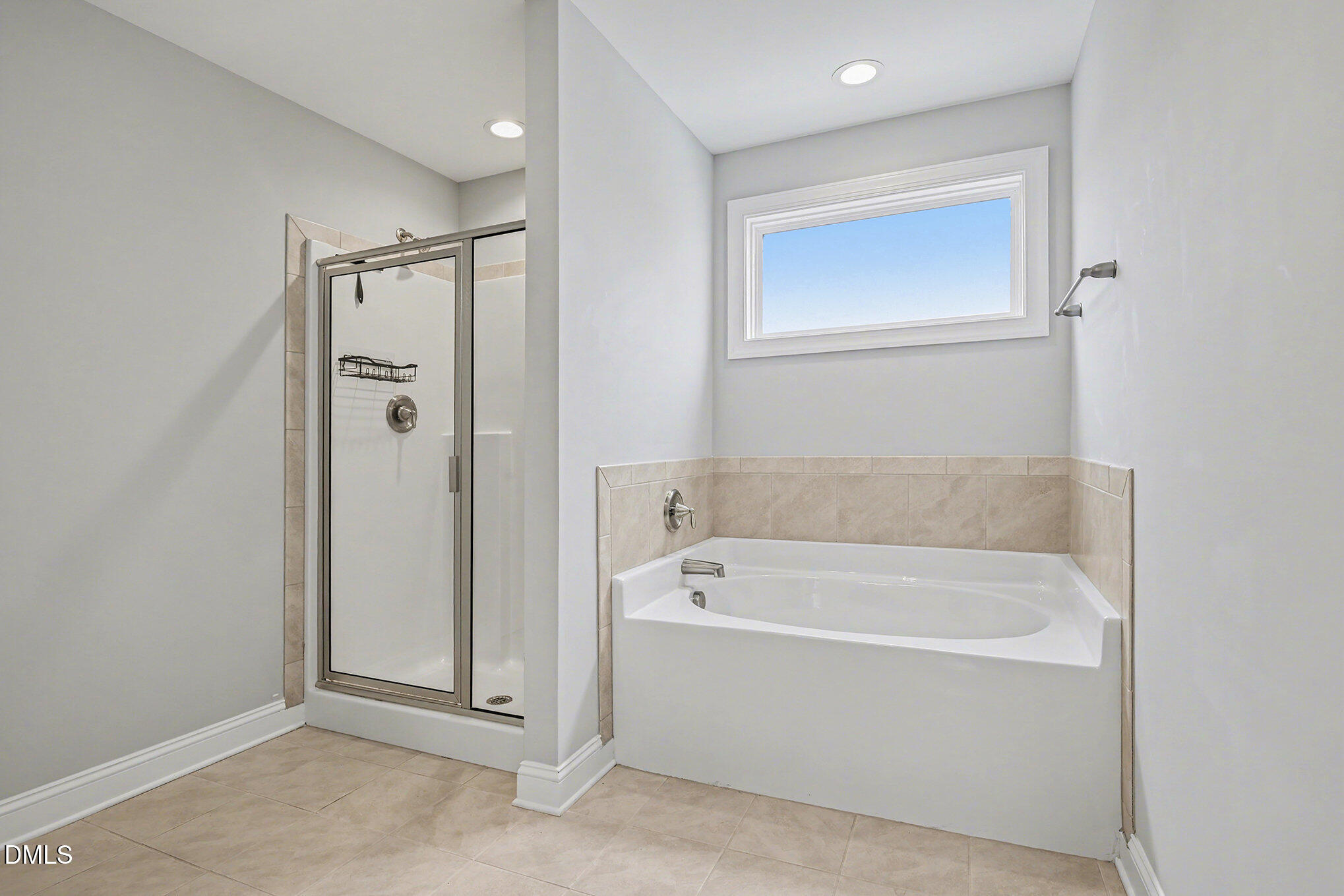 274 Howards Crossing Drive Wendell, NC 27591 - Photo 18 of 40 a white bath tub sitting next to a bathroom