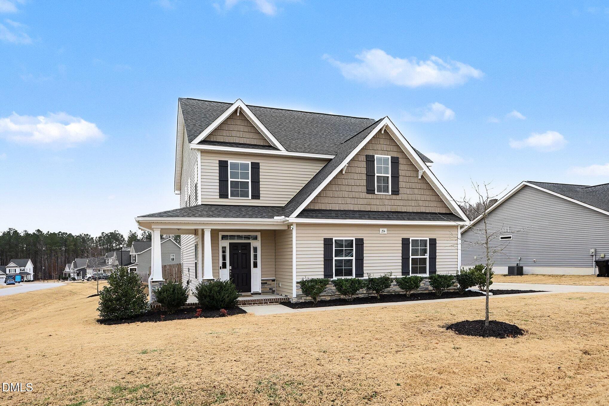 274 Howards Crossing Drive Wendell, NC 27591 - Photo 2 of 40 a front view of a house with a yard