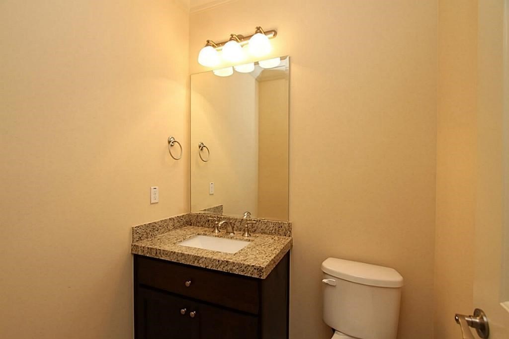 14478 Summerleaf Lane Houston, TX 77077 - Photo 16 of 26 a bathroom with a granite countertop sink and a mirror