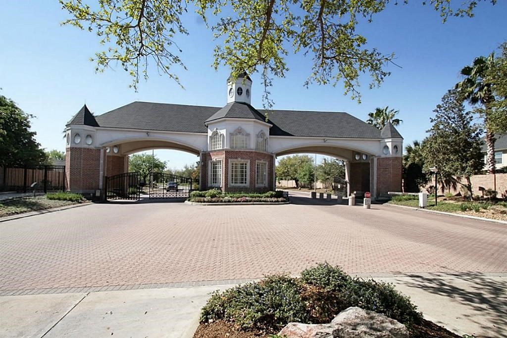 14478 Summerleaf Lane Houston, TX 77077 - Photo 26 of 26 a front view of a house with a yard and garage