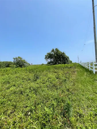 a front view of a house with a ocean view