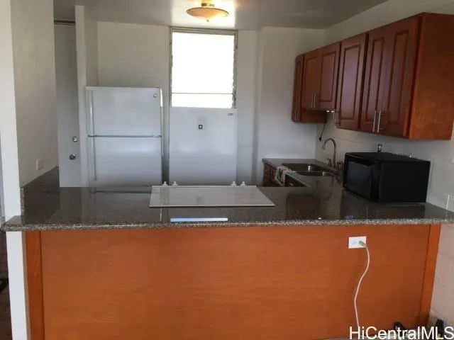 a view of a refrigerator a sink