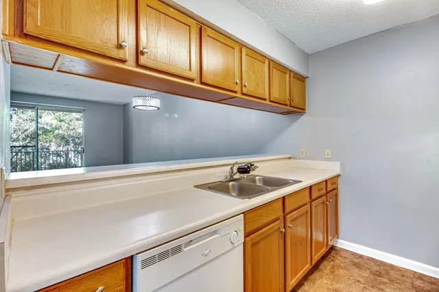 a kitchen with a sink and cabinets