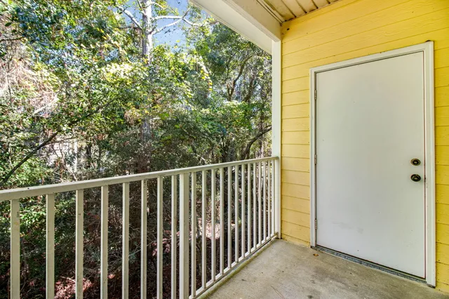 a view of a balcony with an outdoor space