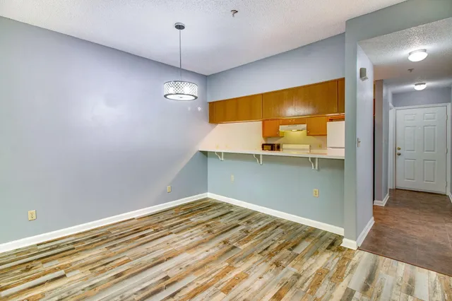 a view of a livingroom with wooden floor