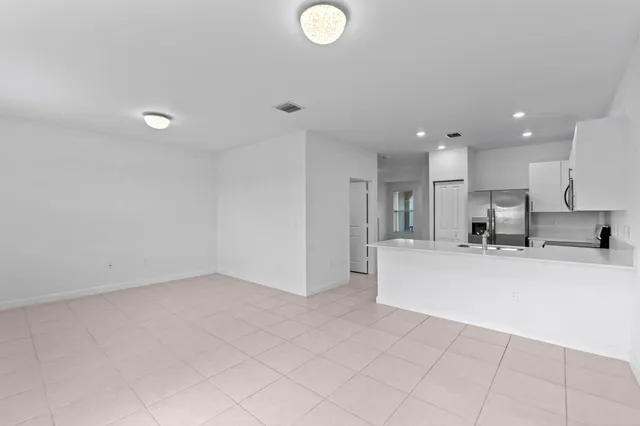 a bathroom with a sink mirror and toilet