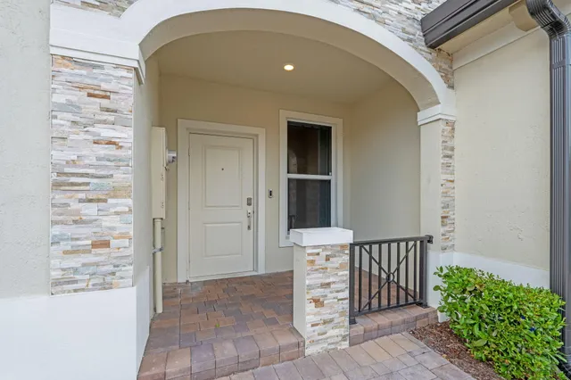 a view of an entryway with white walls