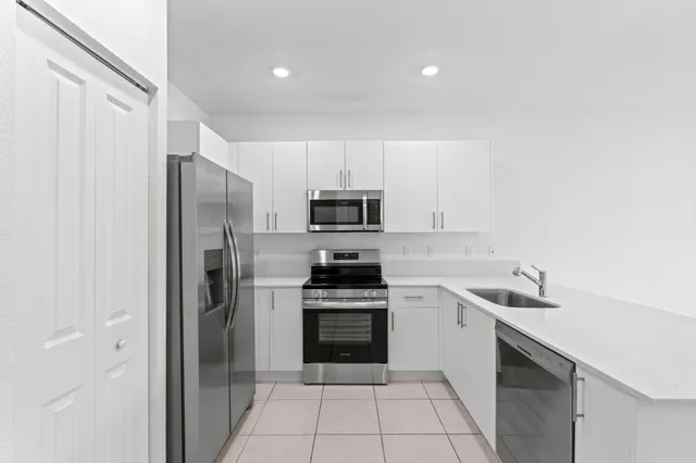 a kitchen with a sink and a window