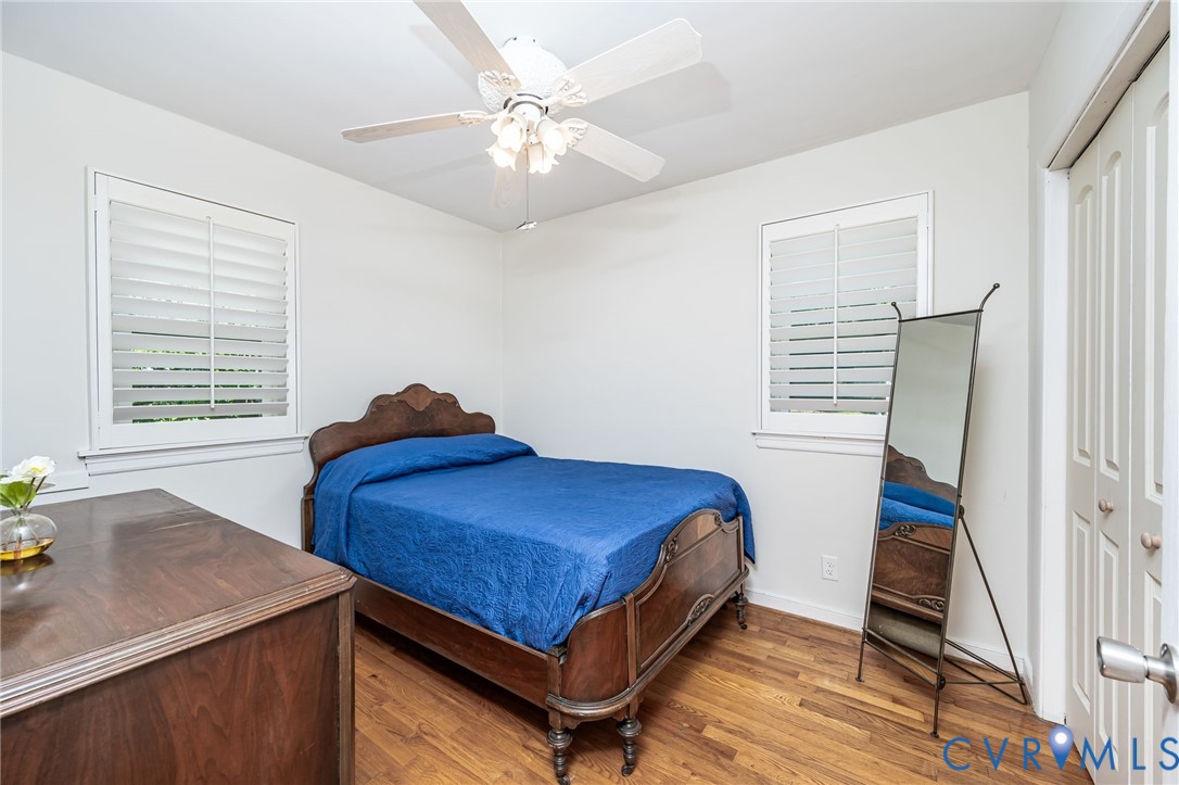 7407 Biscayne Road Henrico, VA 23294 - Photo 17 of 40 a bedroom with a bed and a chandelier