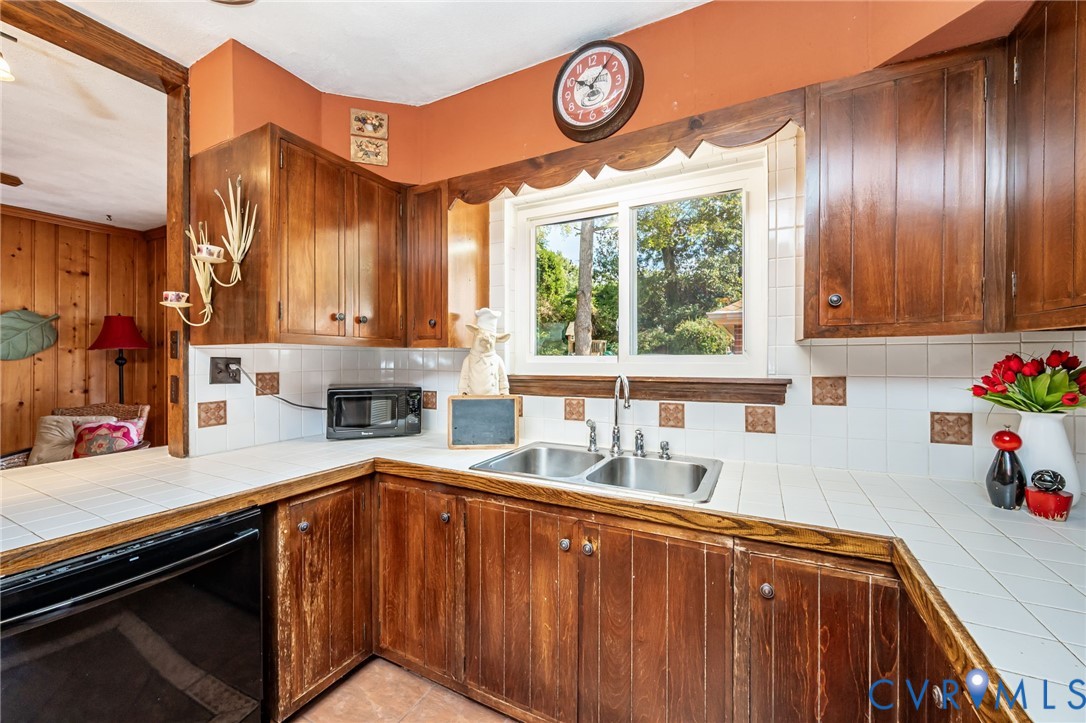 7407 Biscayne Road Henrico, VA 23294 - Photo 22 of 40 a kitchen with granite countertop a stove a sink and a cabinets