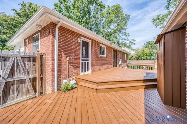 a backyard of a house with wooden deck