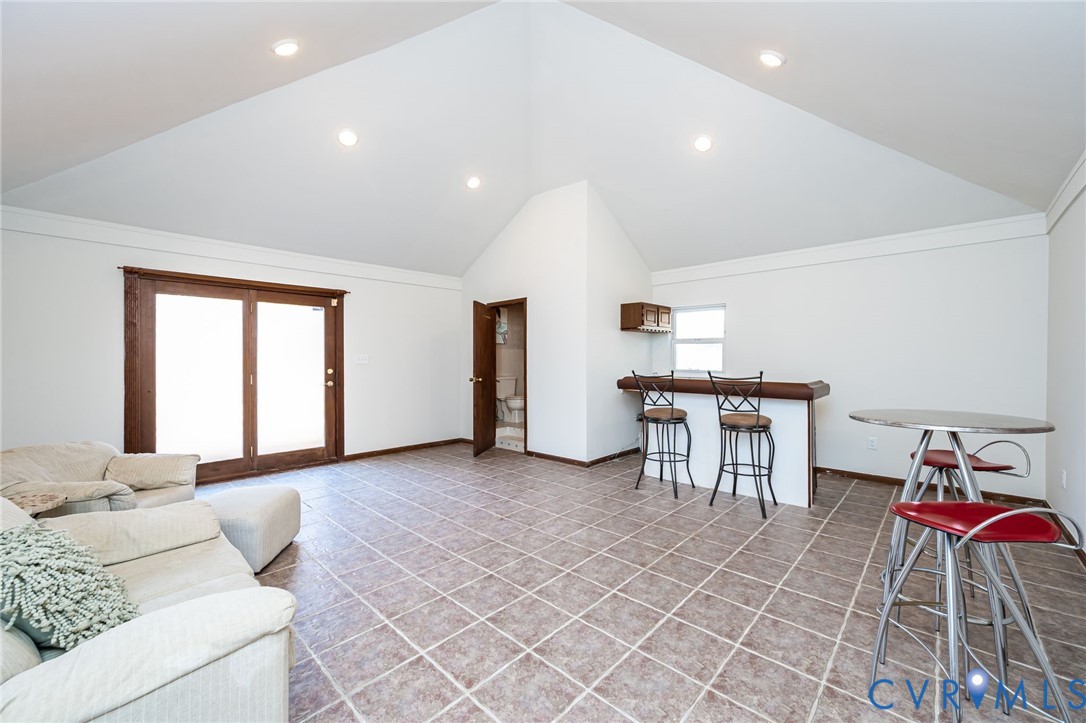 7407 Biscayne Road Henrico, VA 23294 - Photo 32 of 40 a living room with furniture and kitchen view