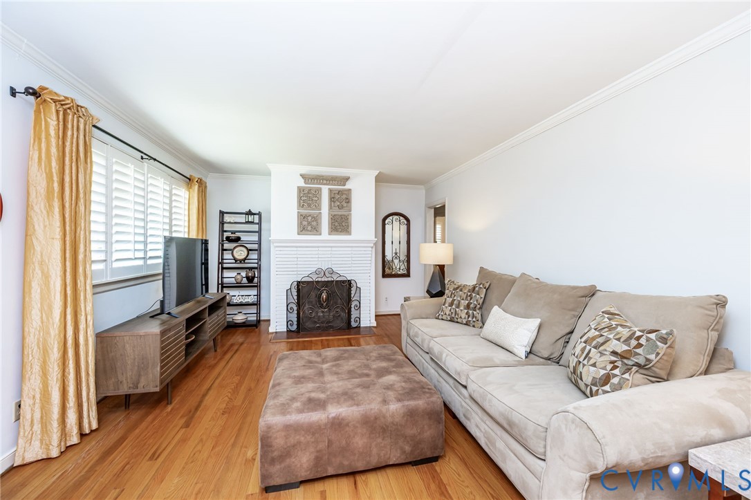 7407 Biscayne Road Henrico, VA 23294 - Photo 7 of 40 a living room with furniture and a fireplace