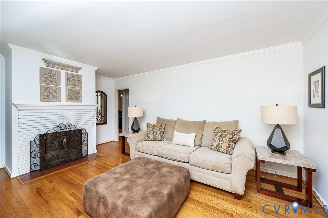 7407 Biscayne Road Henrico, VA 23294 - Photo 8 of 40 a living room with furniture and a fireplace