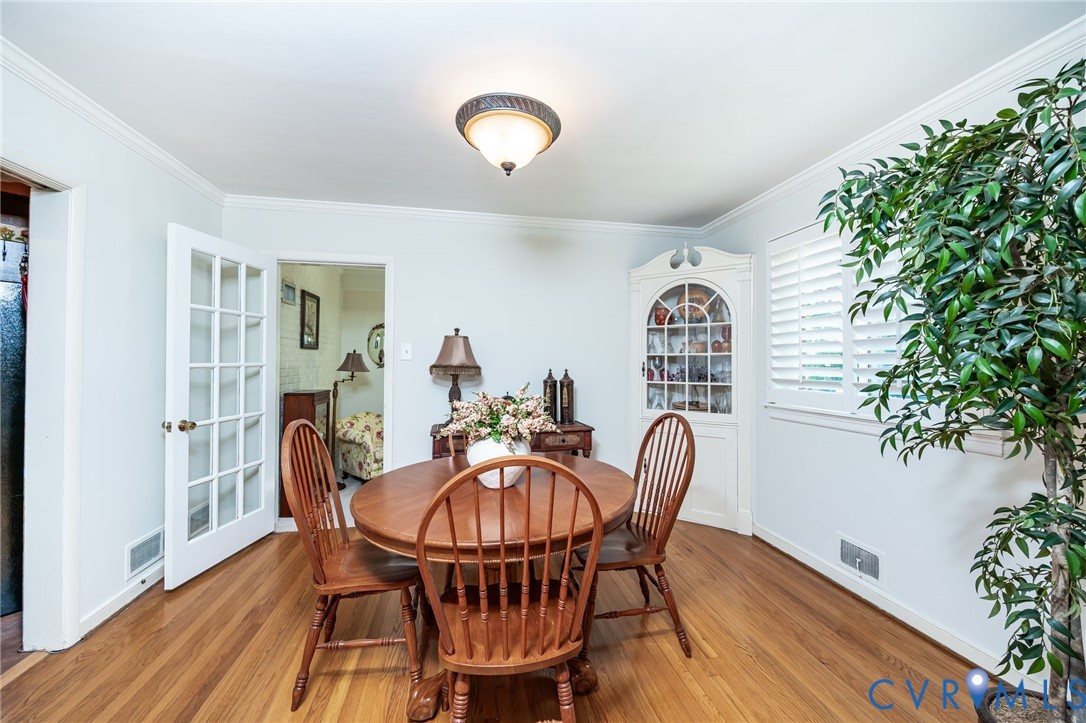 7407 Biscayne Road Henrico, VA 23294 - Photo 10 of 40 a view of a dining room with furniture and wooden floor