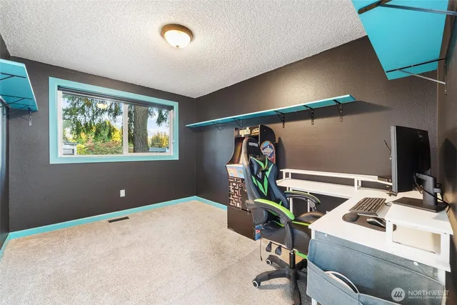 a workspace with furniture and window