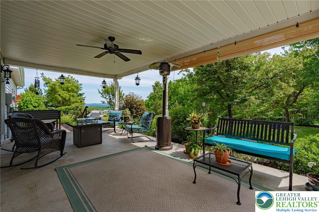4542 Springfield Drive Coplay, PA 18037 - Photo 62 of 89 A sweeping outdoor patio with a covered deck provides an idyllic setting for comfortable relaxation.