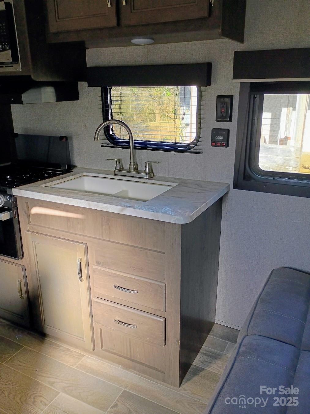 290 Wallace Road Ellenboro, NC 28040 - Photo 16 of 18 a kitchen with a stove and a sink