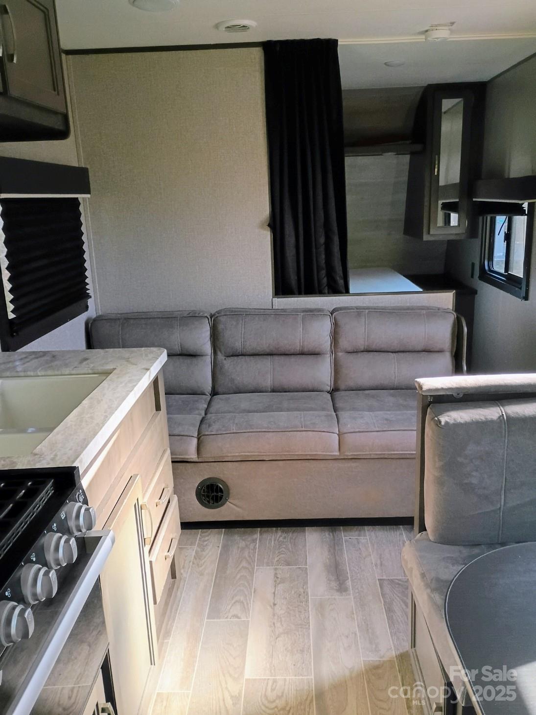 290 Wallace Road Ellenboro, NC 28040 - Photo 18 of 18 a living room with furniture and a fireplace