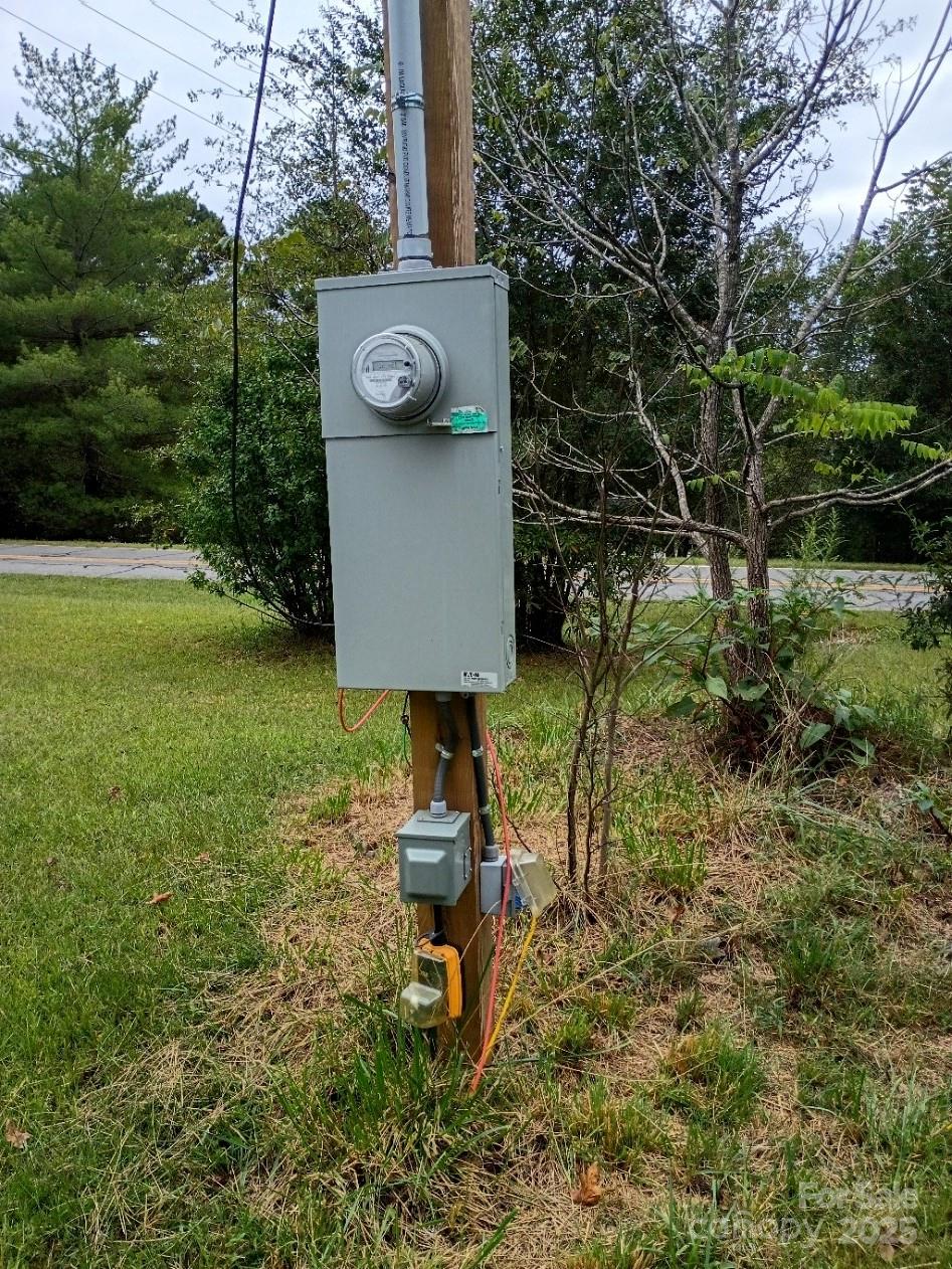 290 Wallace Road Ellenboro, NC 28040 - Photo 3 of 18 a bench is sitting in the middle of a yard
