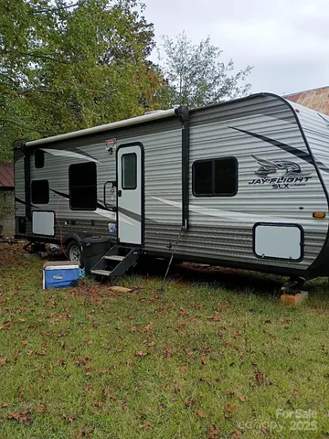 a view of a backyard with sitting area