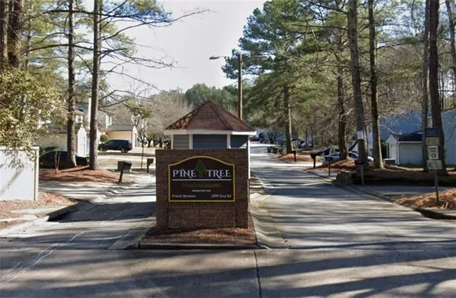 a sign board with parking space