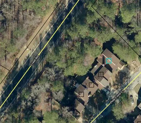 an aerial view of house with yard