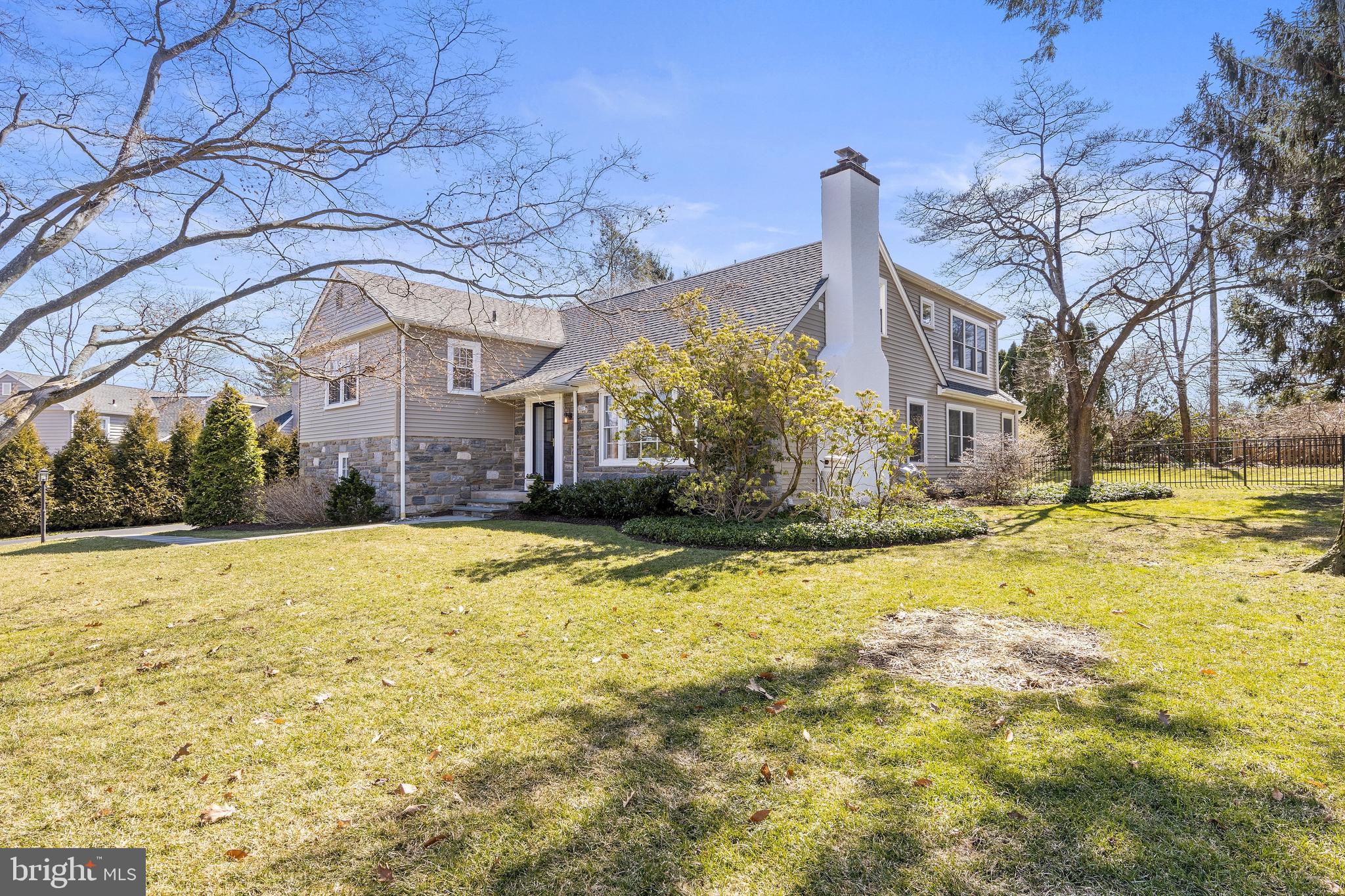 129 Clover Hill Lane Wayne, PA 19087 - Photo 2 of 41 a house with trees in front of it