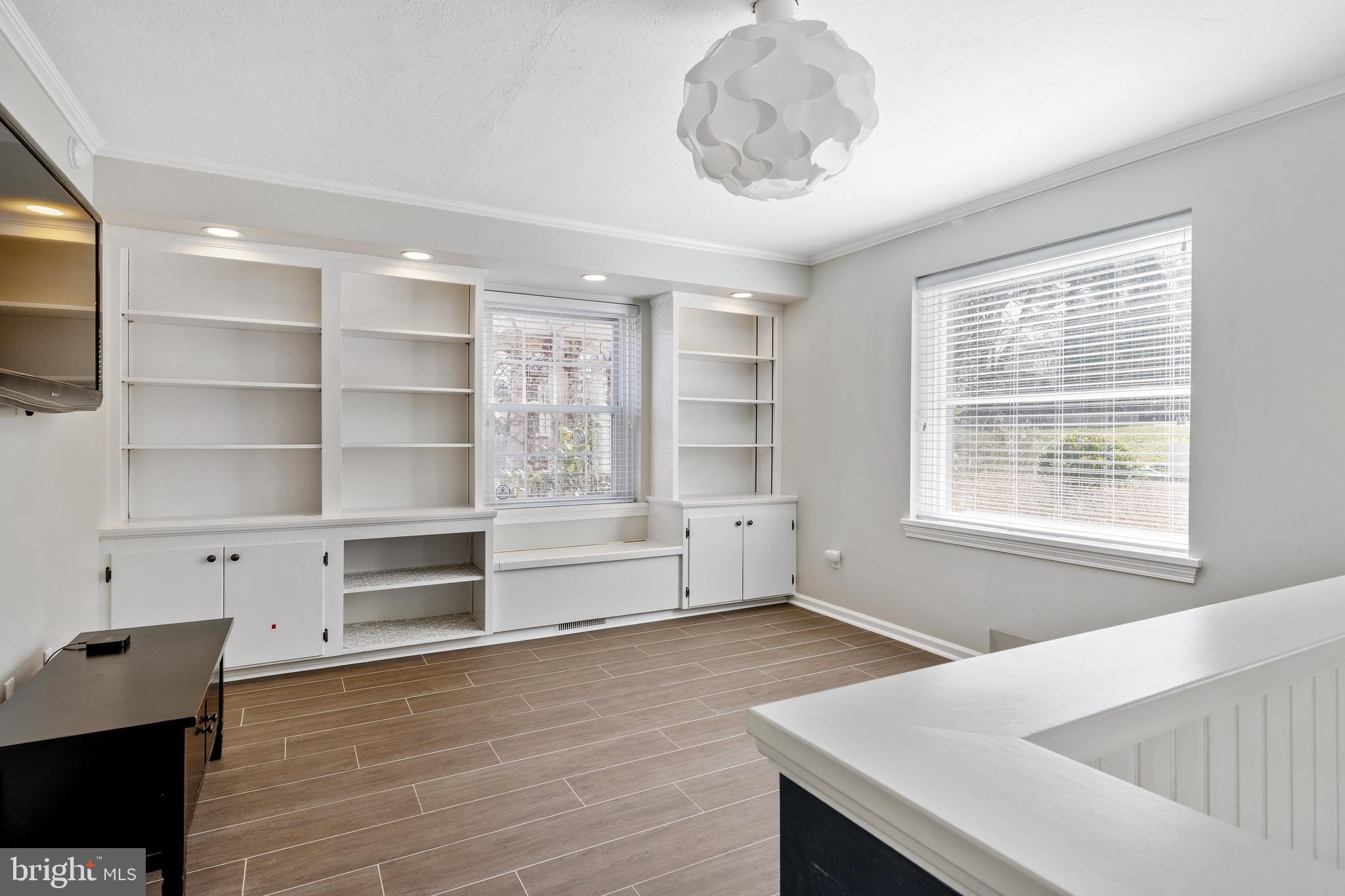 129 Clover Hill Lane Wayne, PA 19087 - Photo 20 of 41 a view of an empty room with a window and wooden floor
