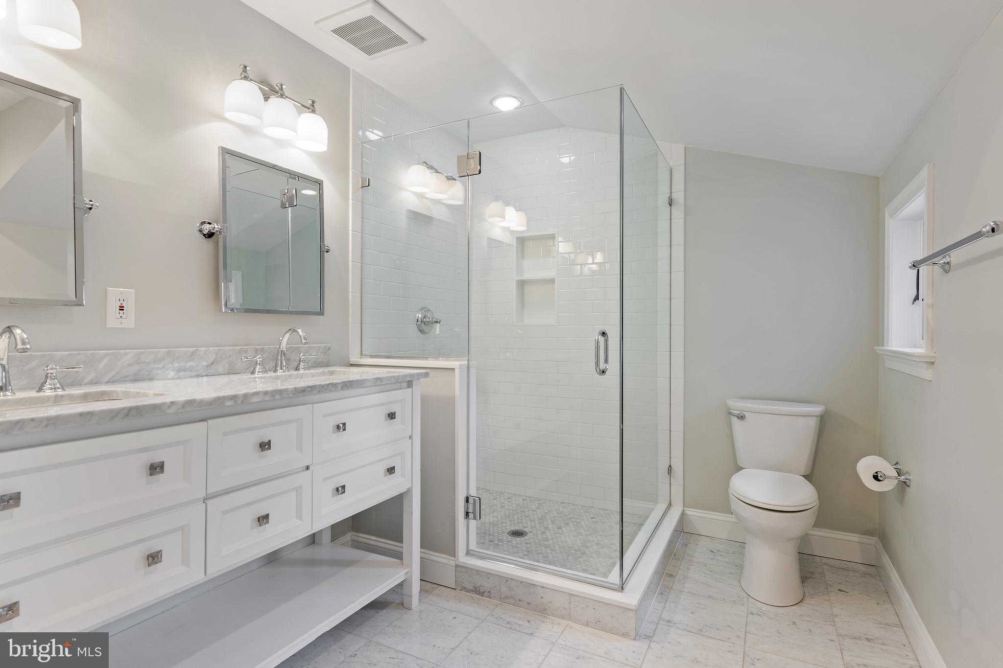 129 Clover Hill Lane Wayne, PA 19087 - Photo 25 of 41 a bathroom with a granite countertop sink a toilet a large mirror and shower