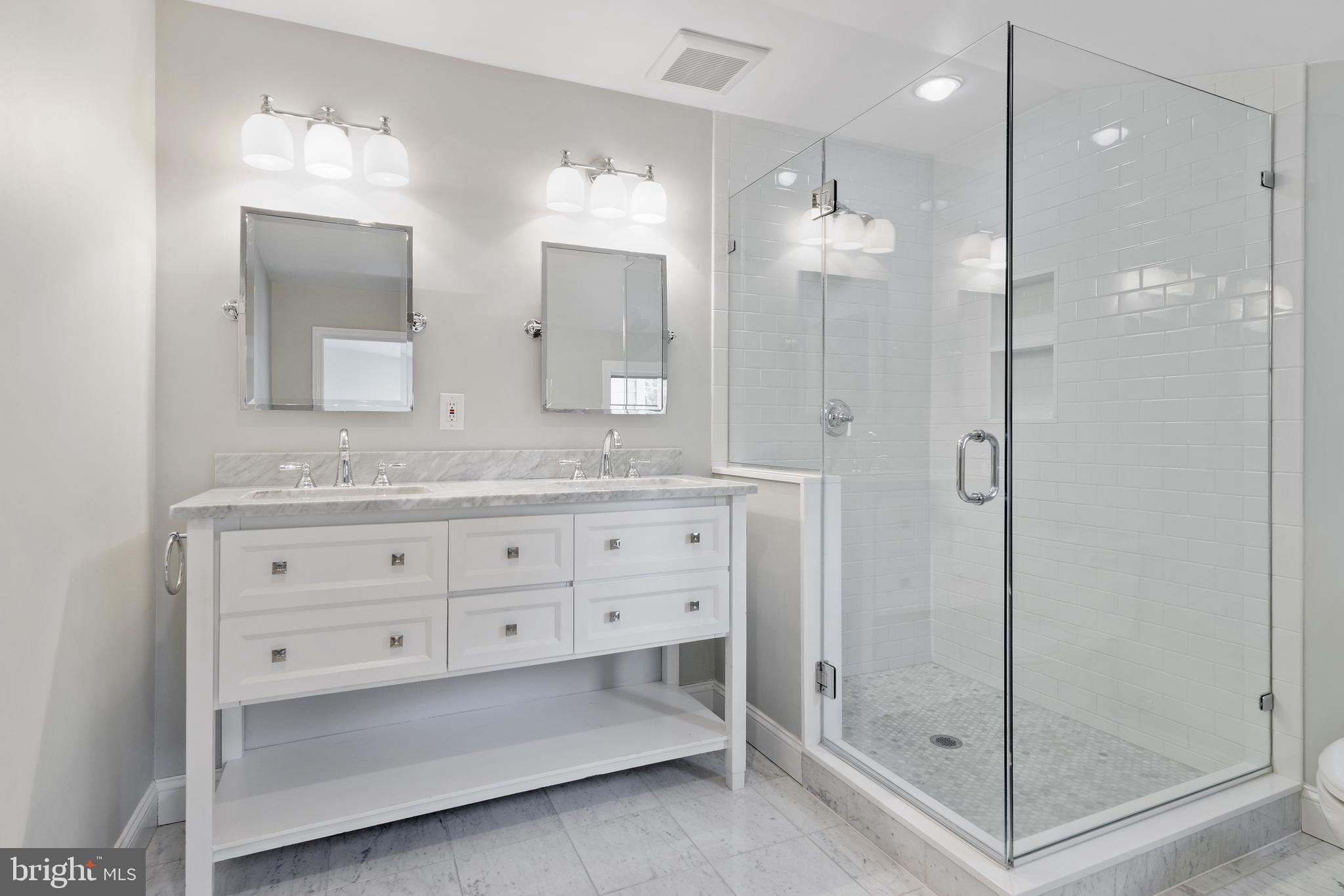 129 Clover Hill Lane Wayne, PA 19087 - Photo 26 of 41 a bathroom with a granite countertop sink mirror and shower