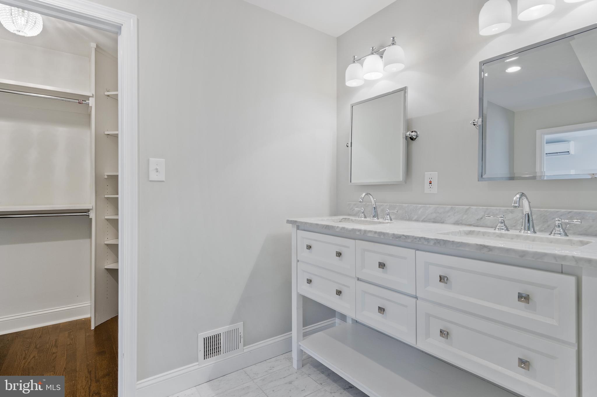 129 Clover Hill Lane Wayne, PA 19087 - Photo 27 of 41 a bathroom with double vanity sink and a mirror