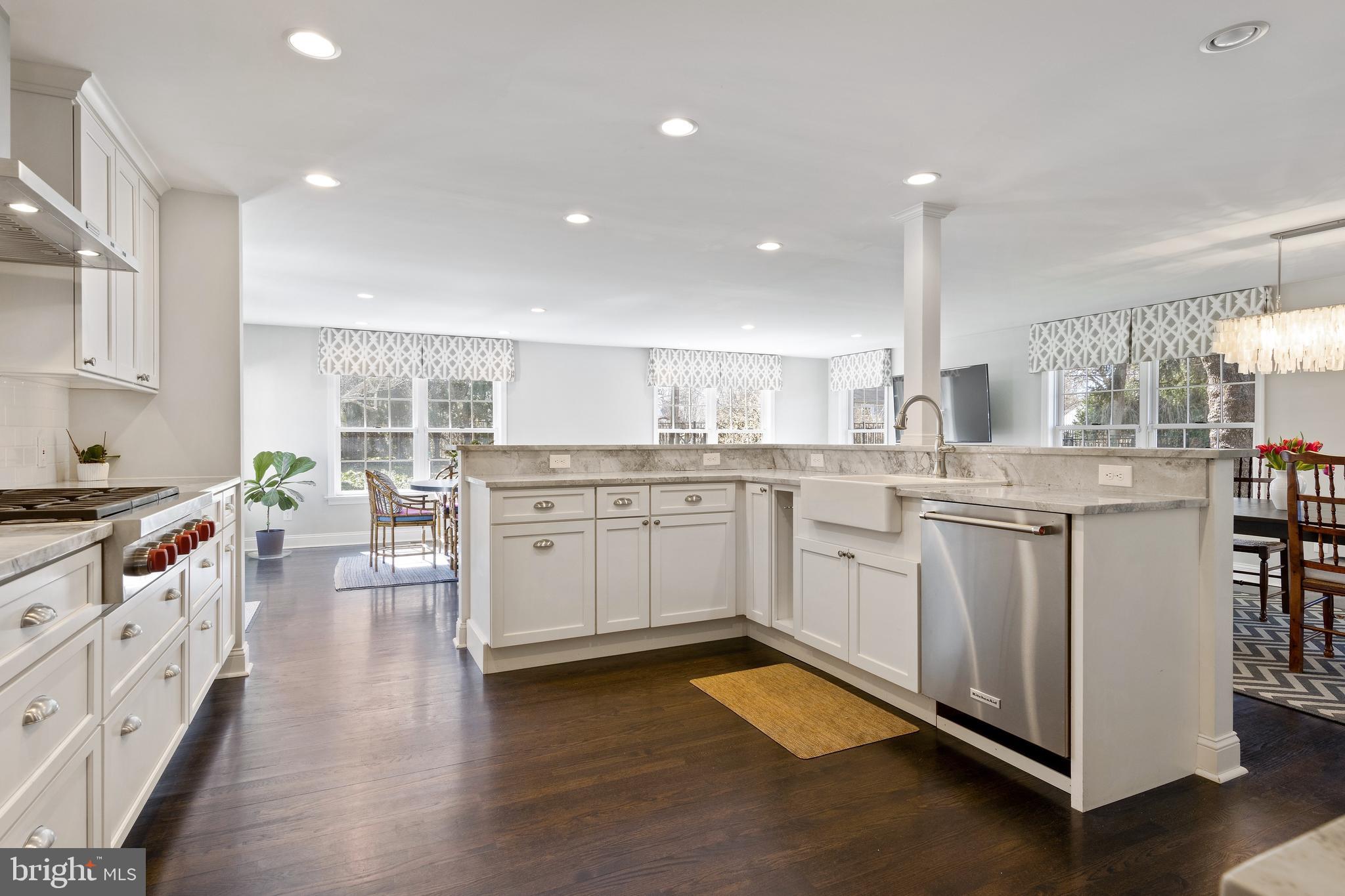 129 Clover Hill Lane Wayne, PA 19087 - Photo 4 of 41 a kitchen with a sink stove and wooden cabinets