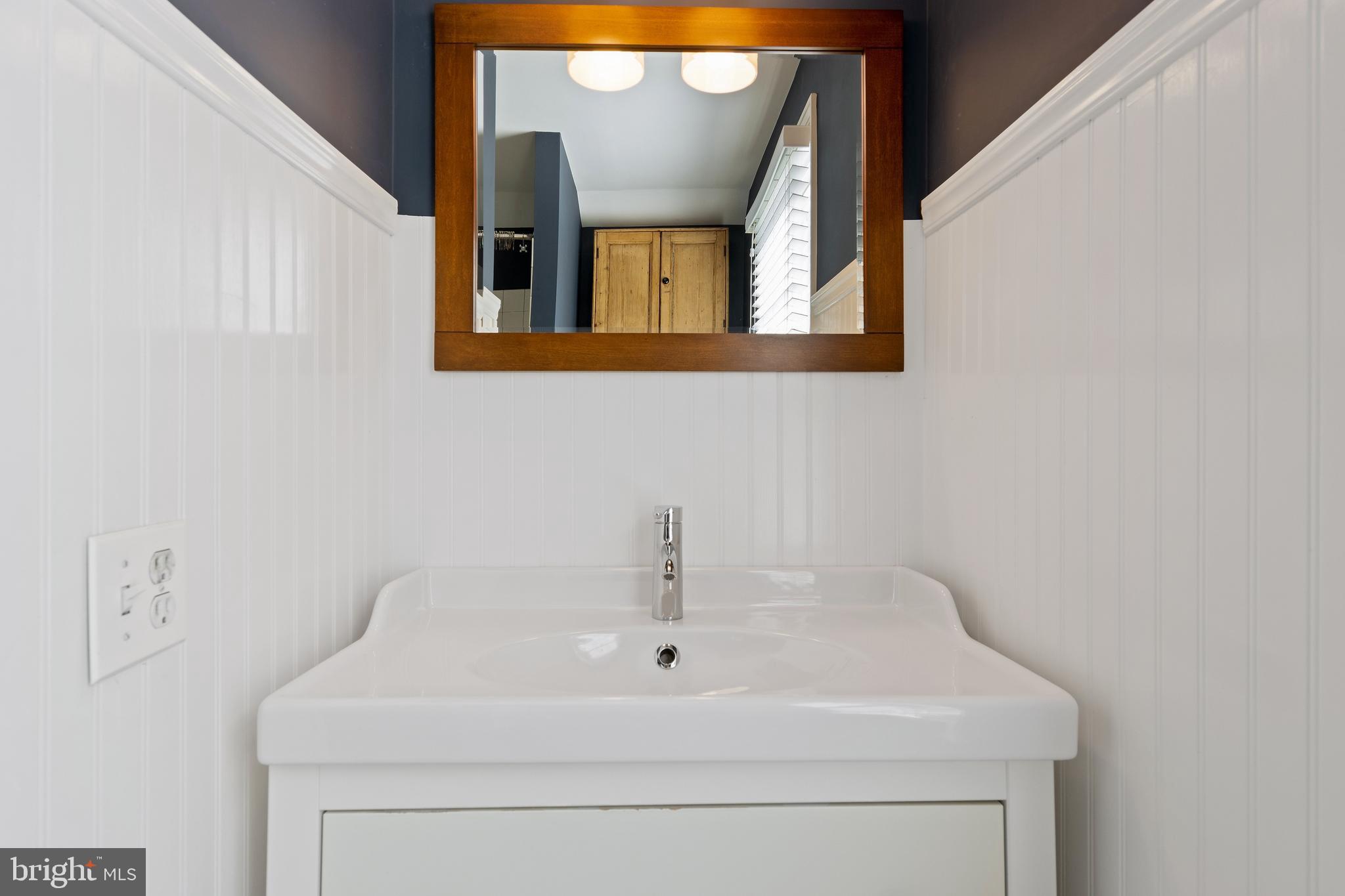 129 Clover Hill Lane Wayne, PA 19087 - Photo 31 of 41 a bathroom with a sink and a mirror