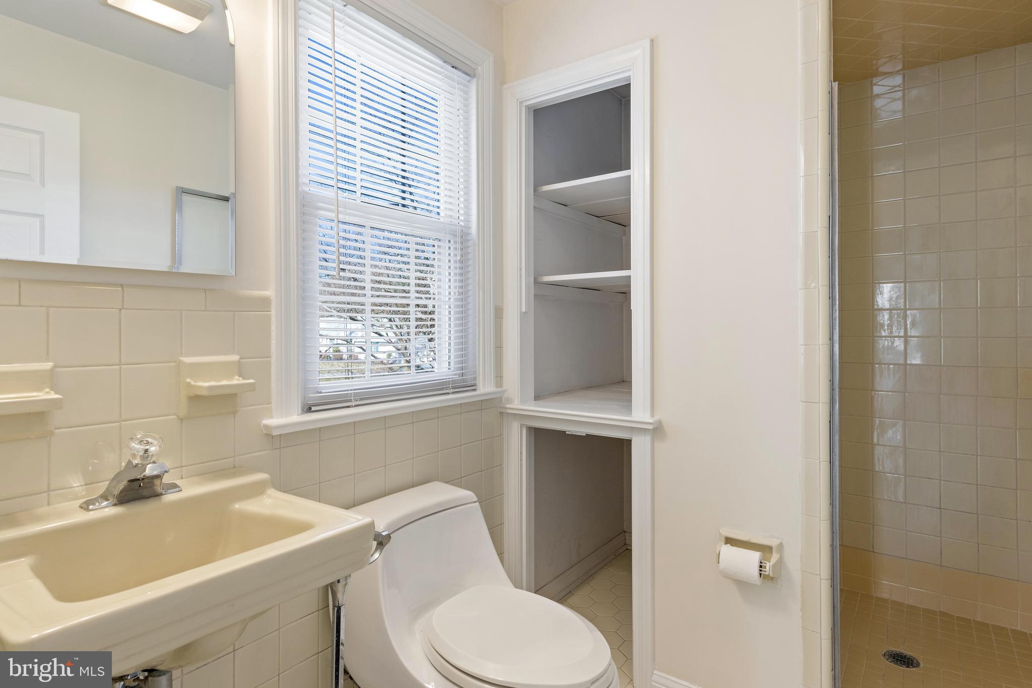 129 Clover Hill Lane Wayne, PA 19087 - Photo 33 of 41 a bathroom with a sink a toilet and shower
