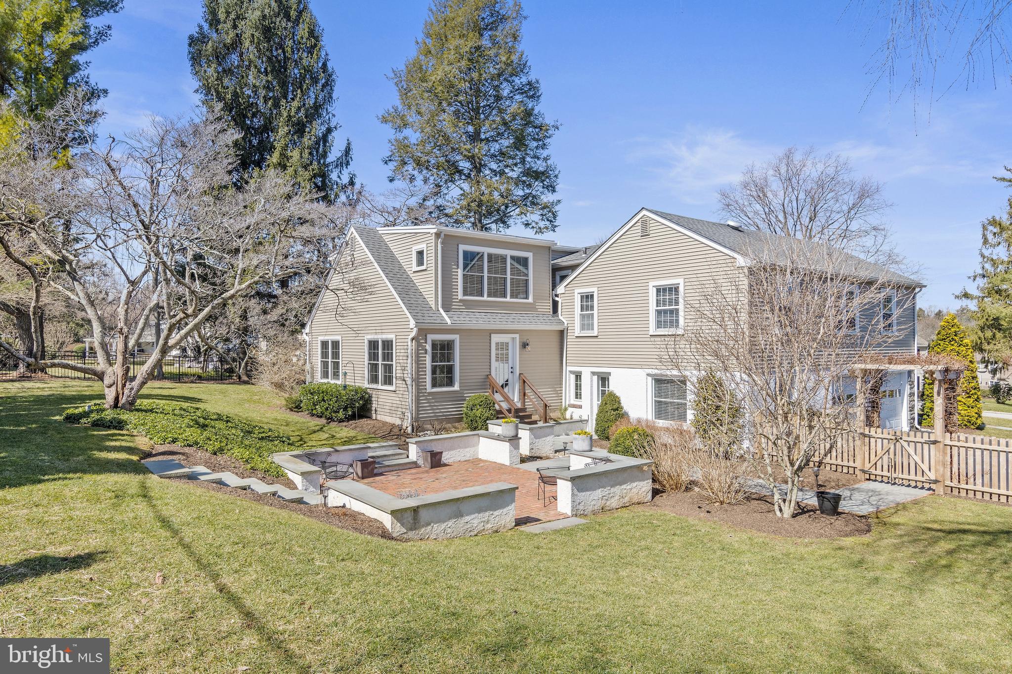 129 Clover Hill Lane Wayne, PA 19087 - Photo 40 of 41 a front view of a house with garden and trees