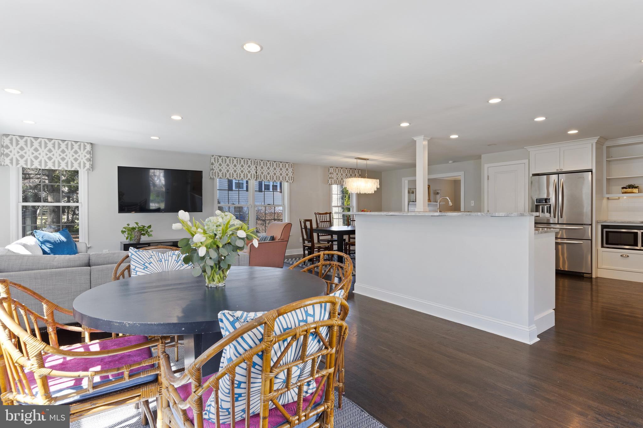 129 Clover Hill Lane Wayne, PA 19087 - Photo 9 of 41 a living room with dining room and wooden floor