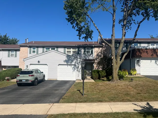 a view of a car park in front of house