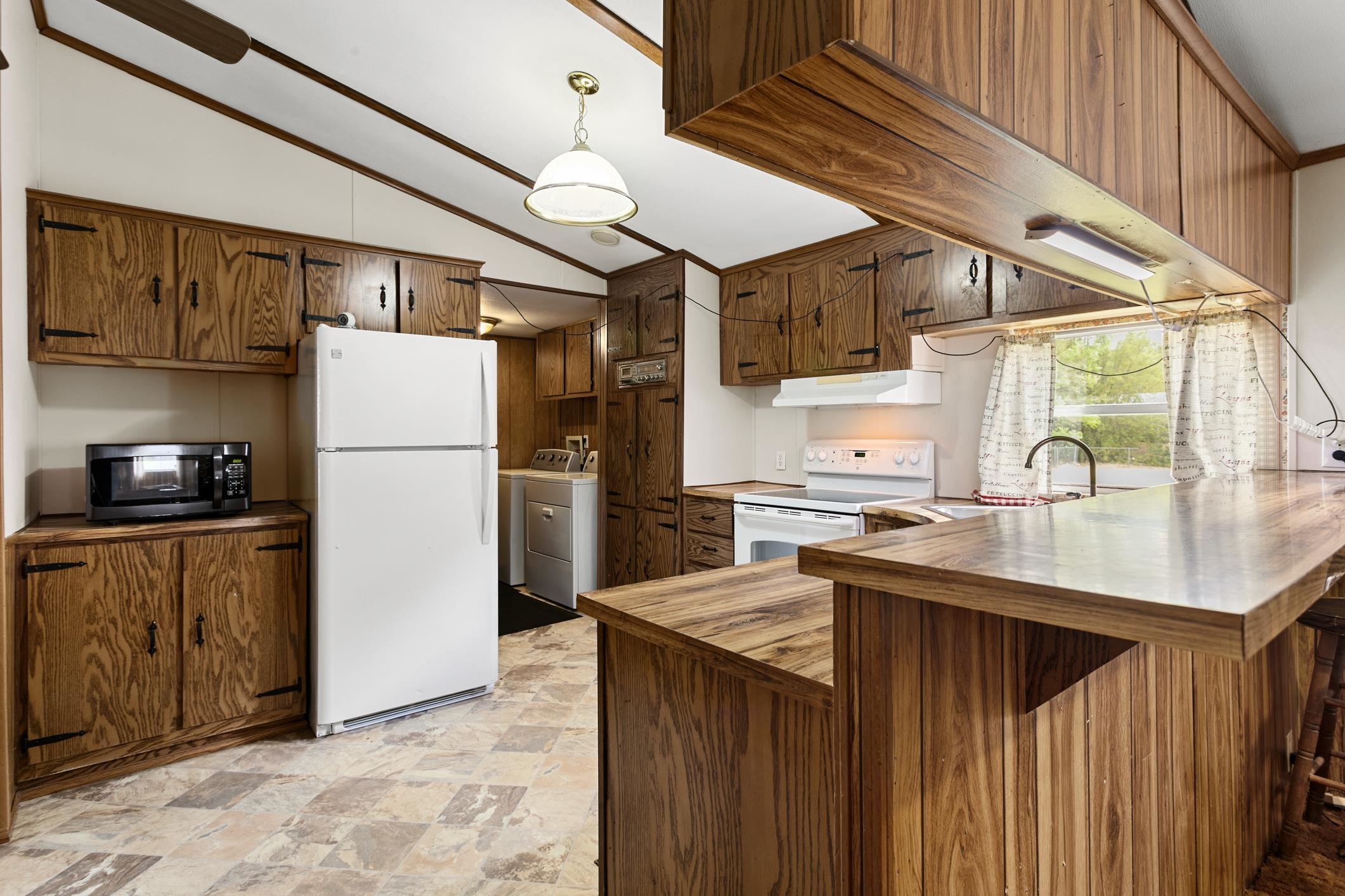 3913 Randall Road Green Cove Springs, FL 32043 - Photo 16 of 43 a kitchen with stainless steel appliances granite countertop a refrigerator a sink and a stove