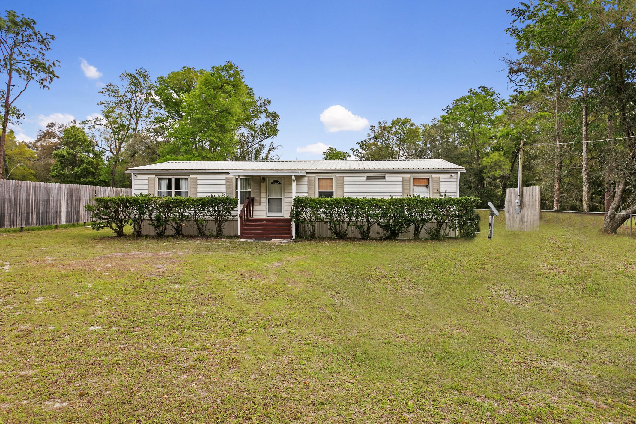 3913 Randall Road Green Cove Springs, FL 32043 - Photo 2 of 43 a view of a house with backyard and sitting area