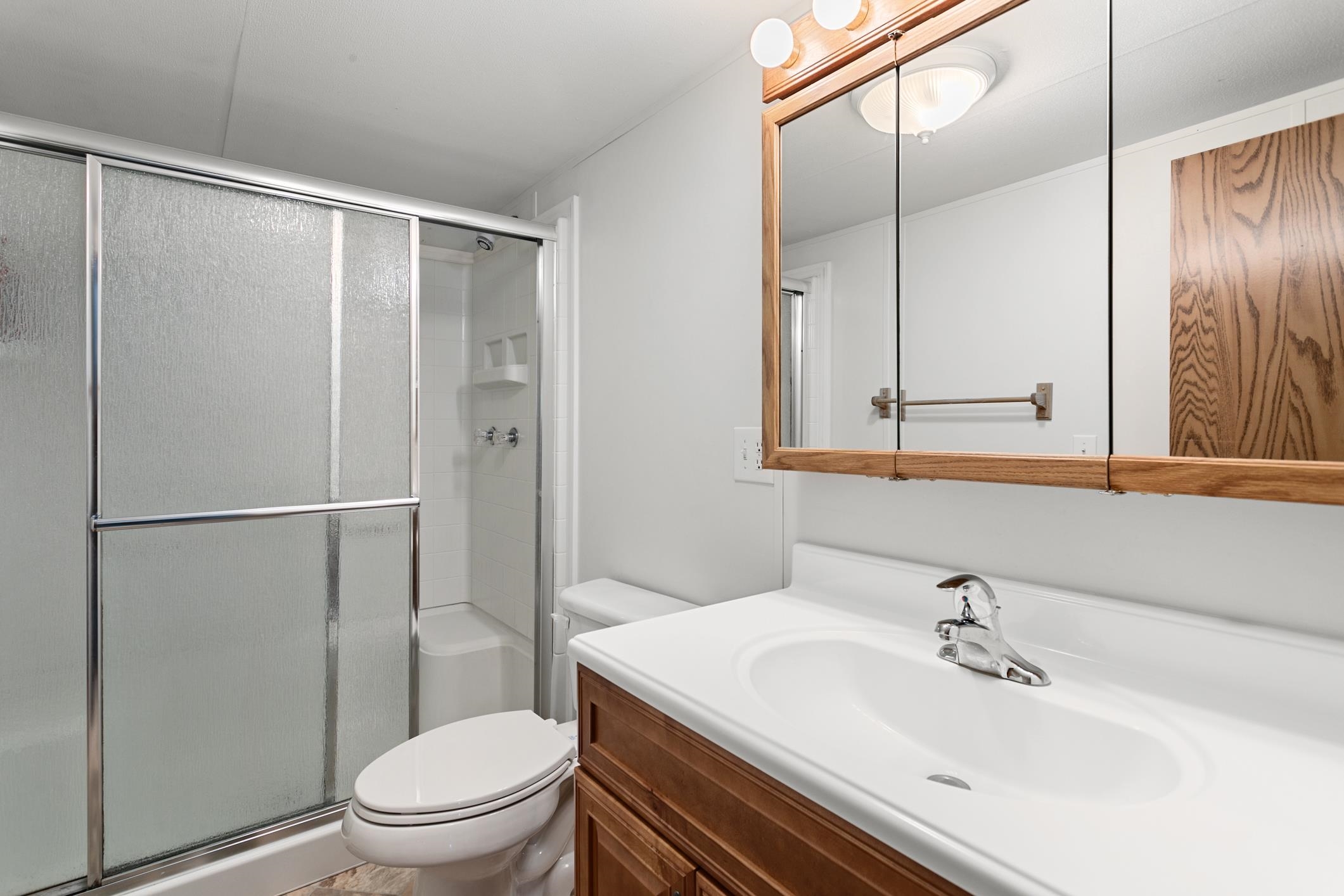 3913 Randall Road Green Cove Springs, FL 32043 - Photo 24 of 43 a bathroom with a sink toilet and shower