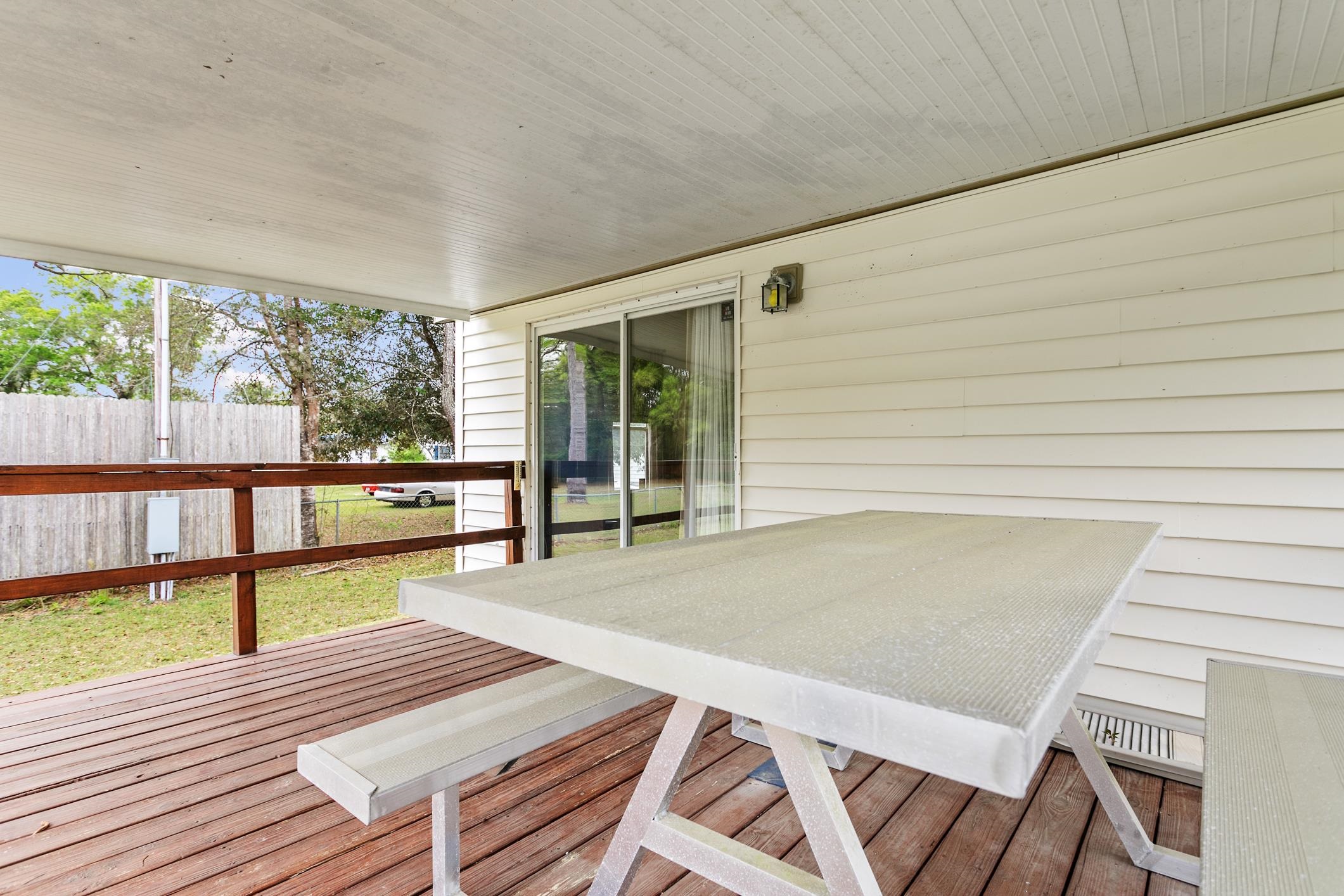 3913 Randall Road Green Cove Springs, FL 32043 - Photo 28 of 43 a view of a patio with wooden floor
