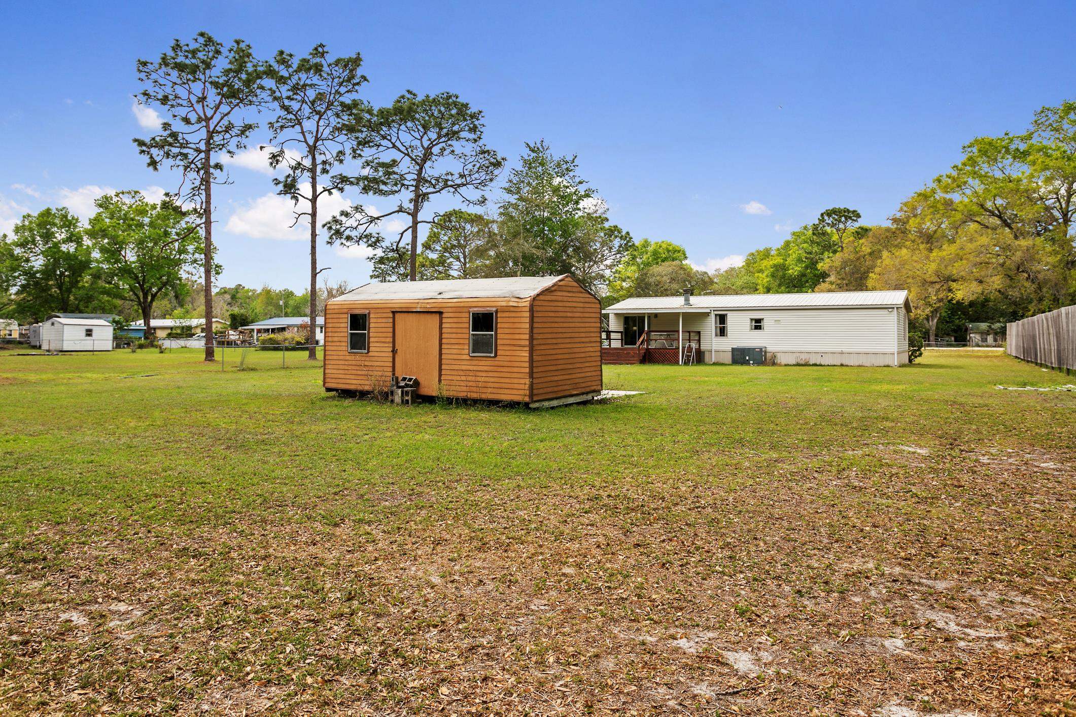 3913 Randall Road Green Cove Springs, FL 32043 - Photo 33 of 43 a view of a house with a yard