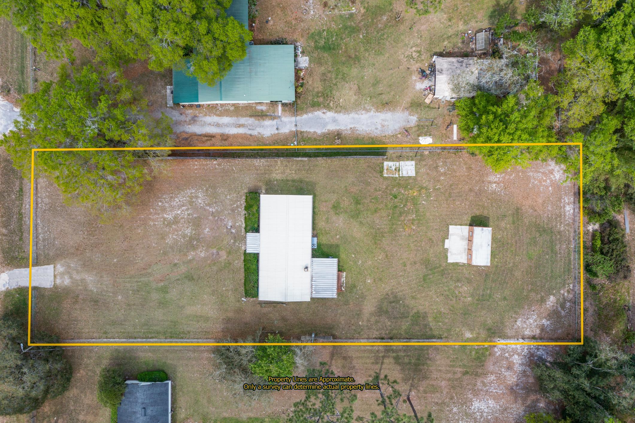 3913 Randall Road Green Cove Springs, FL 32043 - Photo 40 of 43 an aerial view of a residential houses with outdoor space
