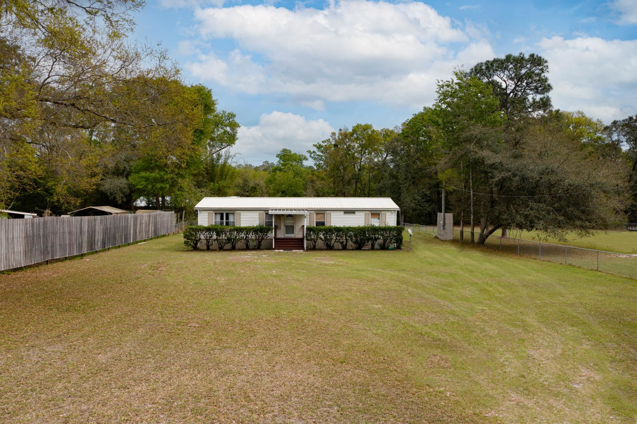 3913 Randall Road Green Cove Springs, FL 32043 - Photo 43 of 43 a view of a house with pool and chairs