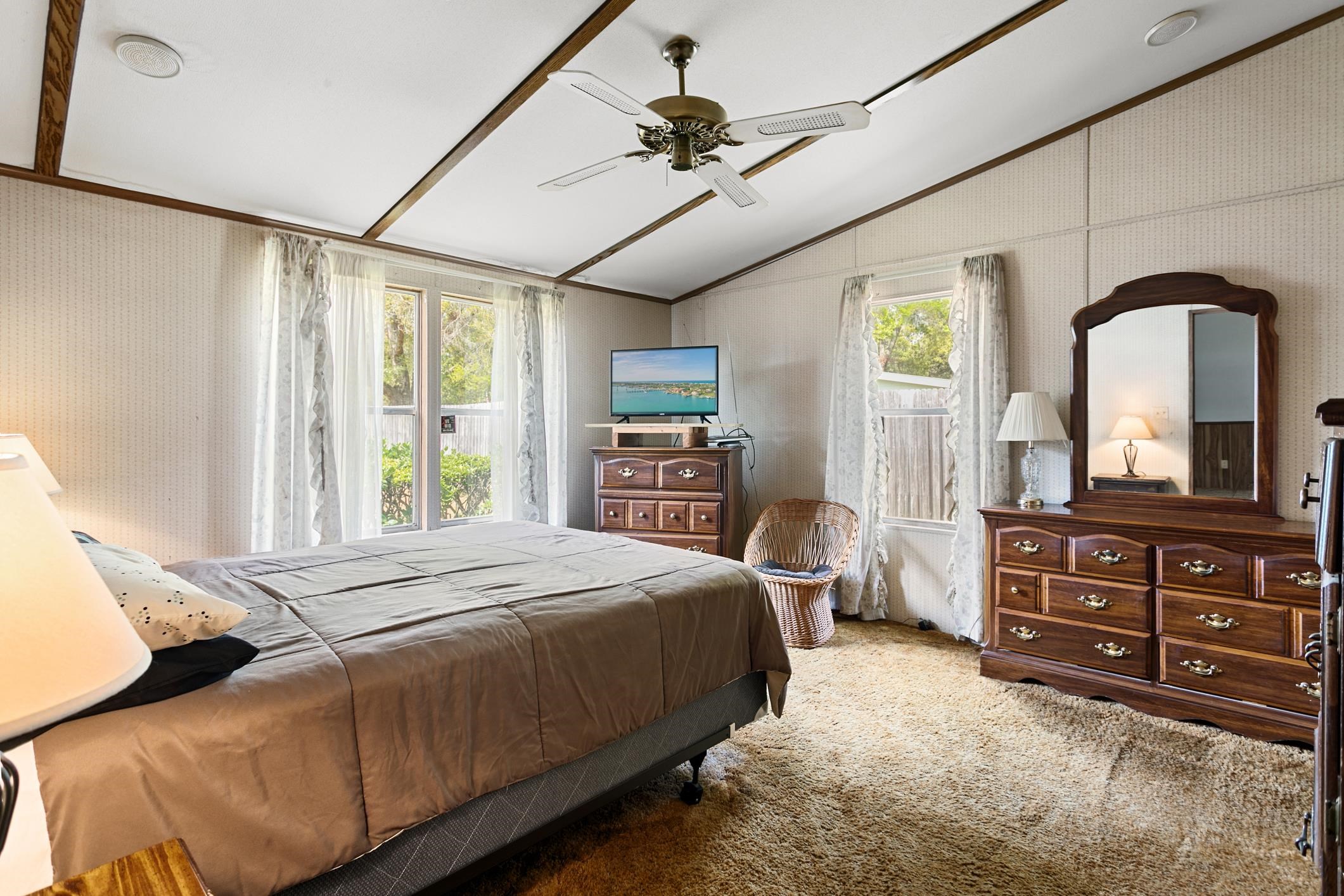 3913 Randall Road Green Cove Springs, FL 32043 - Photo 7 of 43 a bedroom with a bed and a dresser