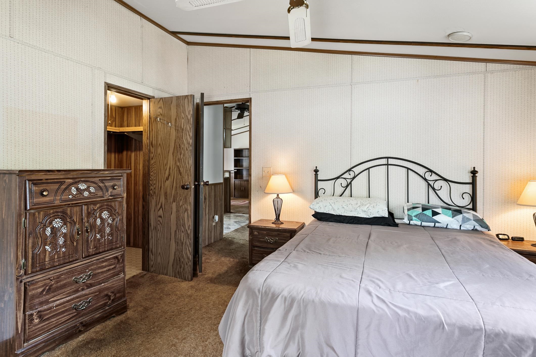 3913 Randall Road Green Cove Springs, FL 32043 - Photo 9 of 43 a bedroom with a bed window and a walk in closet
